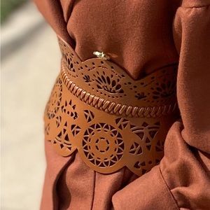 Women wide waist peplum corset statement belt. Laser cut detail.